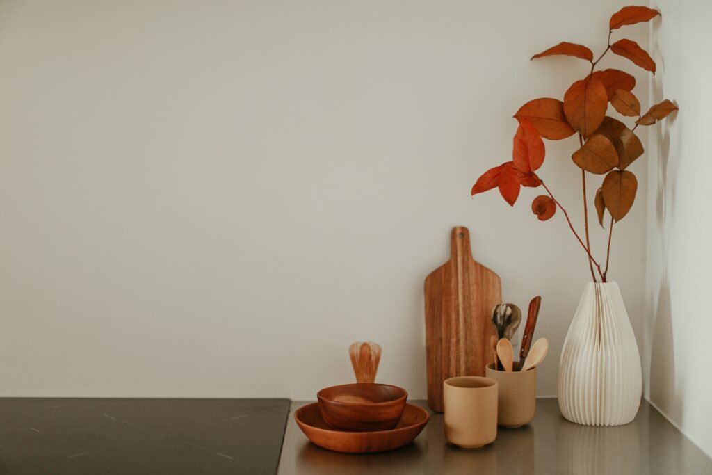 Cozy fall kitchen decor with warm wood, ivory, and rust accents
