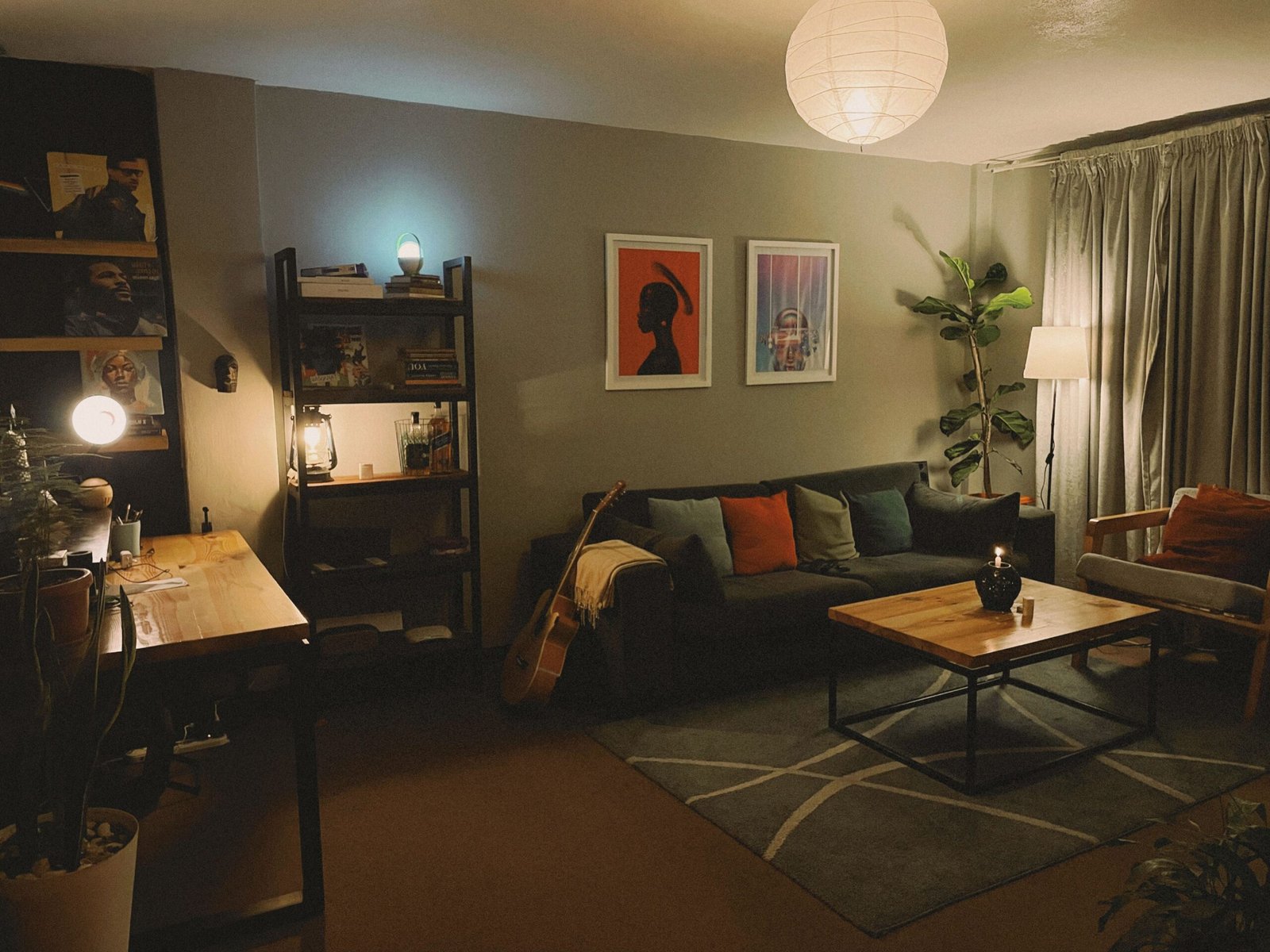 Cozy apartment living room with warm layered lighting from lamps and ambient light